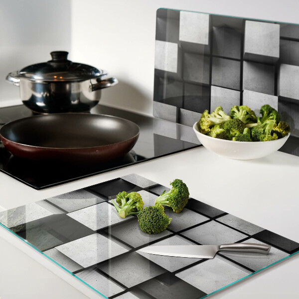 Tagliere in vetro con motivi geometrici nei toni del grigio