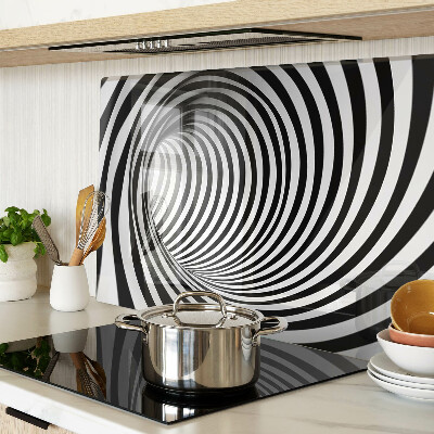 Tagliere in vetro con motivo a spirale nei toni del bianco e nero