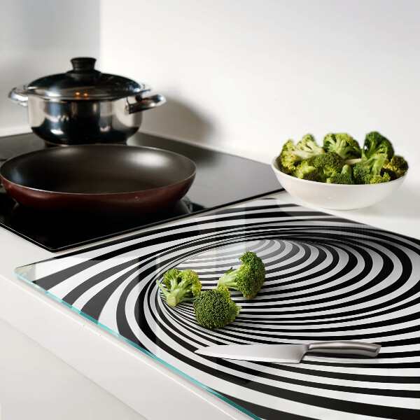 Tagliere in vetro con motivo a spirale nei toni del bianco e nero