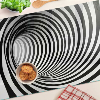 Tagliere in vetro con motivo a spirale nei toni del bianco e nero
