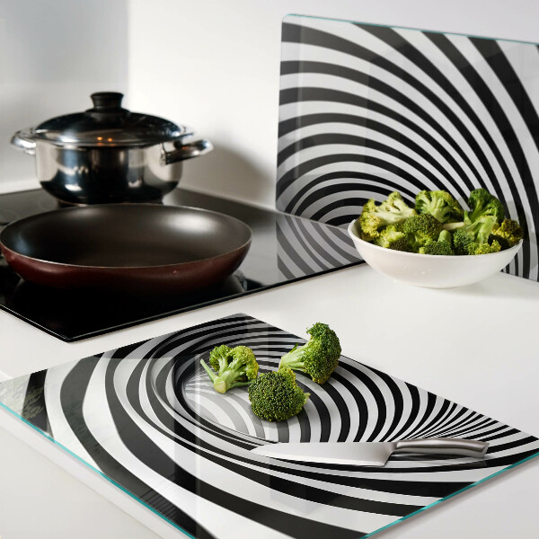 Tagliere in vetro con motivo a spirale nei toni del bianco e nero