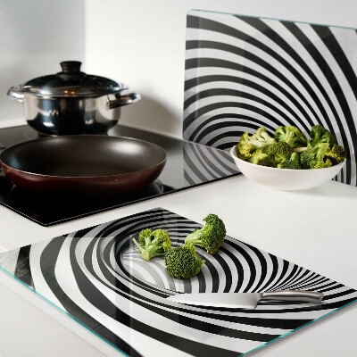 Tagliere in vetro con motivo a spirale nei toni del bianco e nero