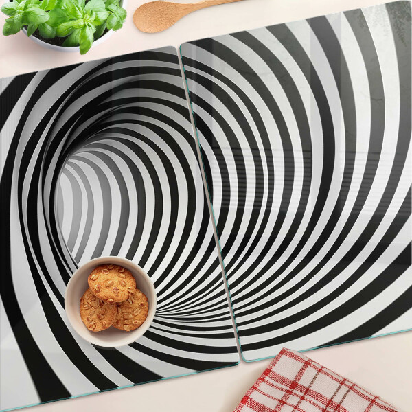 Tagliere in vetro con motivo a spirale nei toni del bianco e nero