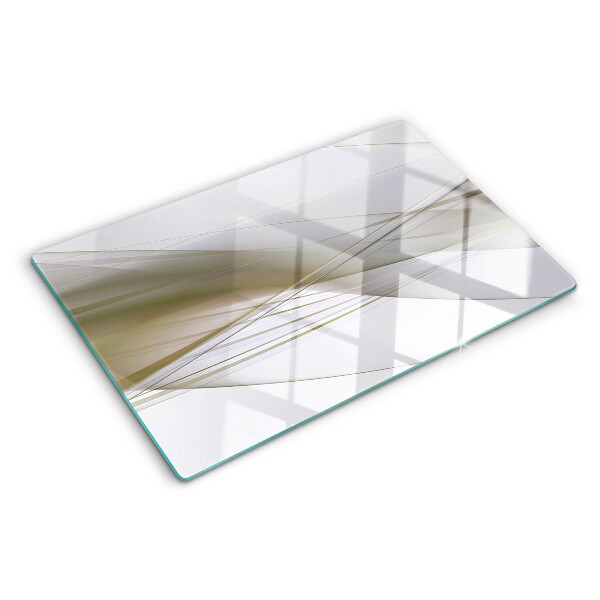 Tagliere in vetro con motivo di linee e forme astratte