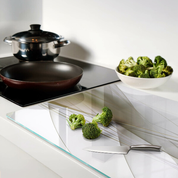 Tagliere in vetro con motivo di linee e forme astratte