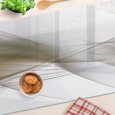 Tagliere in vetro con motivo di linee e forme astratte