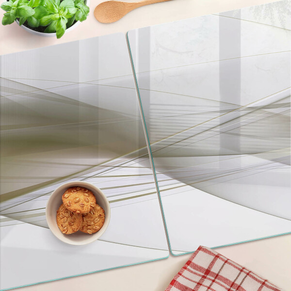 Tagliere in vetro con motivo di linee e forme astratte