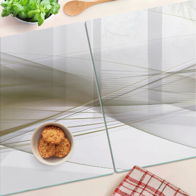 Tagliere in vetro con motivo di linee e forme astratte