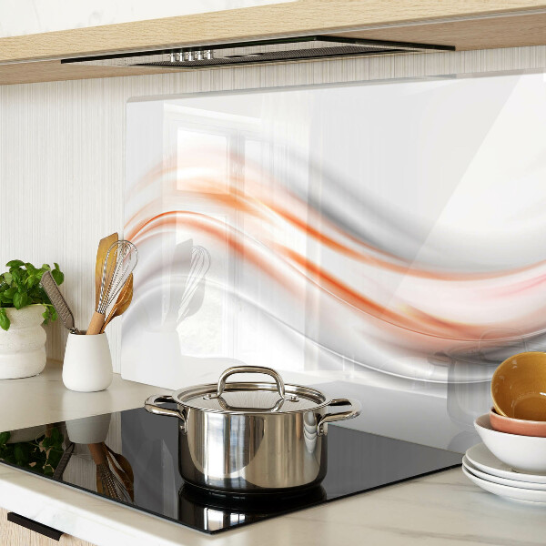 Tagliere in vetro con motivo a onde nei toni dell'arancione e del grigio