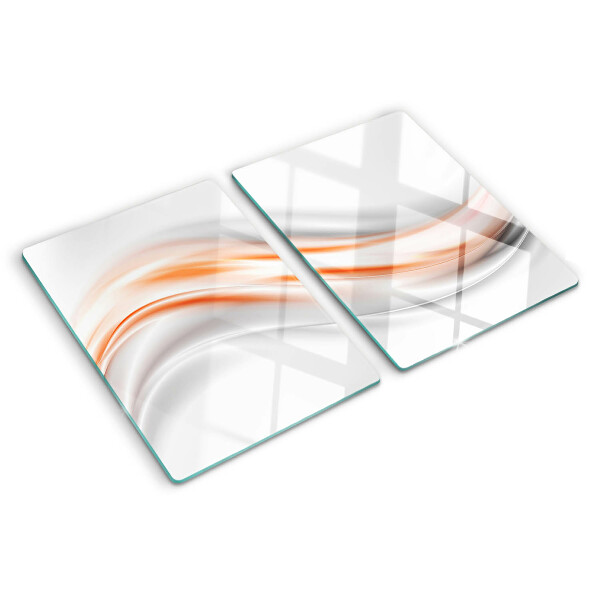 Tagliere in vetro con motivo a onde nei toni dell'arancione e del grigio