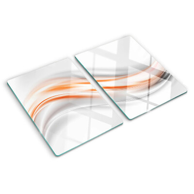 Tagliere in vetro con motivo a onde nei toni dell'arancione e del grigio