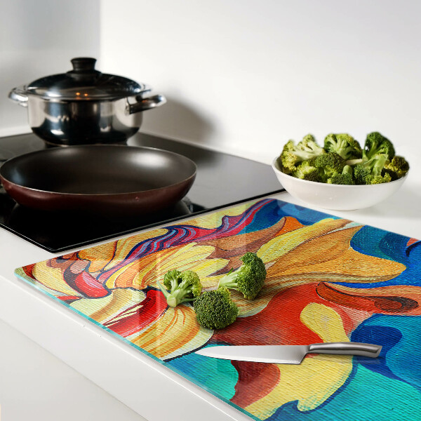 Tagliere in vetro temperato con fiori colorati su uno sfondo astratto