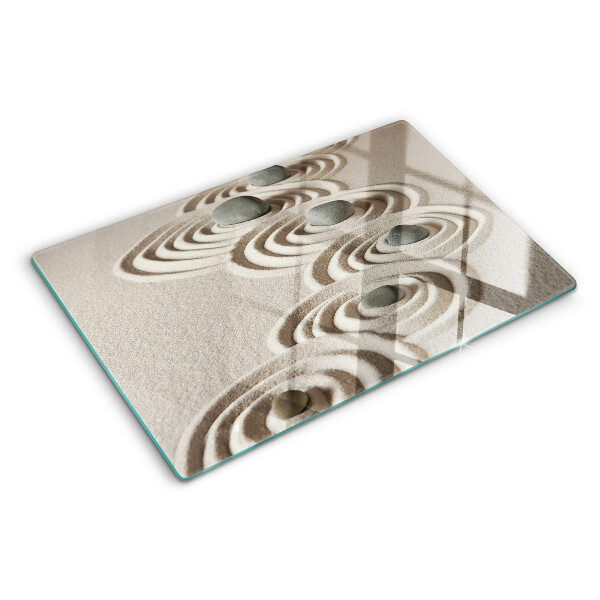 Tagliere in vetro con motivi ondulati ispirati alla sabbia