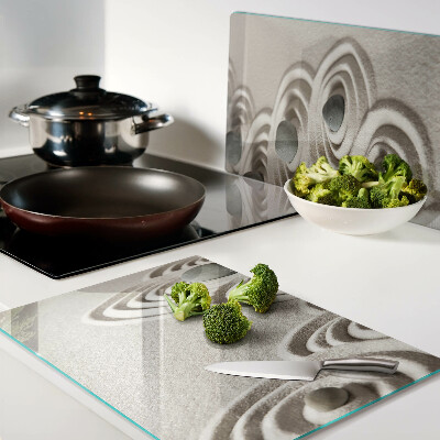 Tagliere in vetro con motivi ondulati ispirati alla sabbia