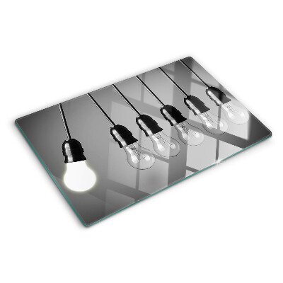 Tagliere in vetro temperato con motivo a lampadine sui cavi