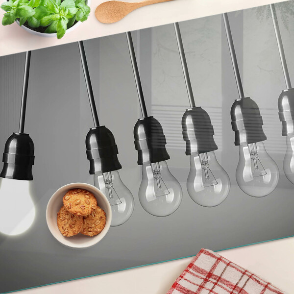 Tagliere in vetro temperato con motivo a lampadine sui cavi