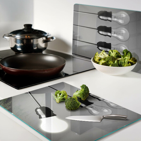 Tagliere in vetro temperato con motivo a lampadine sui cavi