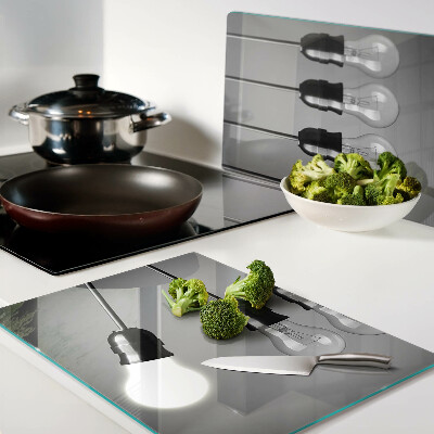 Tagliere in vetro temperato con motivo a lampadine sui cavi