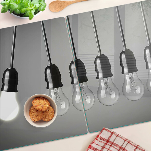 Tagliere in vetro temperato con motivo a lampadine sui cavi