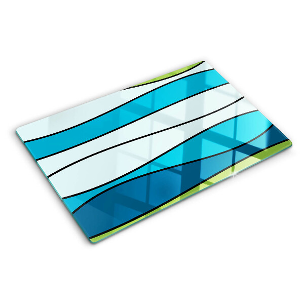 Tagliere in vetro con motivo a onde nei toni del blu e del verde