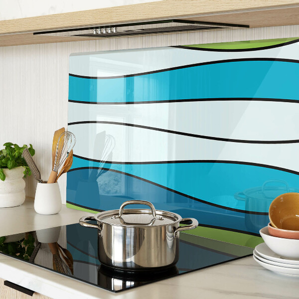 Tagliere in vetro con motivo a onde nei toni del blu e del verde