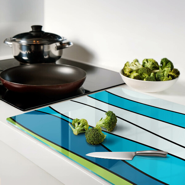 Tagliere in vetro con motivo a onde nei toni del blu e del verde