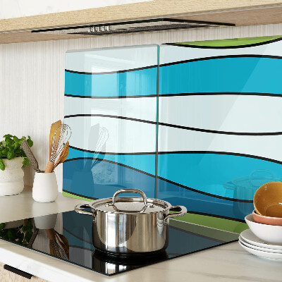 Tagliere in vetro con motivo a onde nei toni del blu e del verde