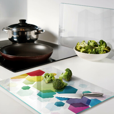 Tagliere in vetro con motivo a esagoni colorati sullo sfondo