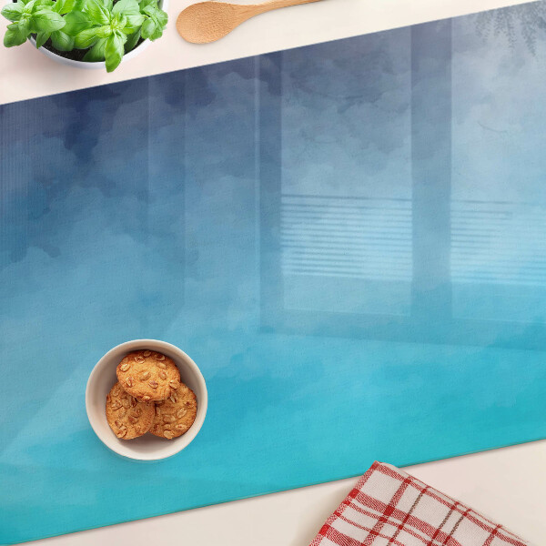 Tagliere in vetro con finitura trasparente nei toni del blu effetto nebbia