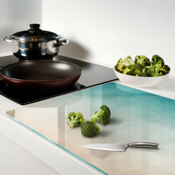 Tagliere in vetro temperato con gradiente nei toni del blu e dell'arancione