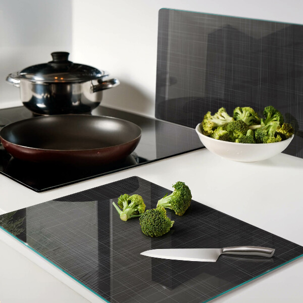 Tagliere in vetro con motivo geometrico di linee e ombre