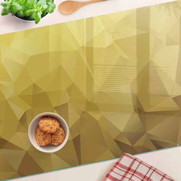 Tagliere in vetro temperato con motivo geometrico nei toni dell'oro