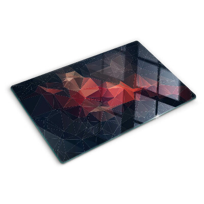 Tagliere in vetro temperato con motivo a geometria astratta nei toni del rosso