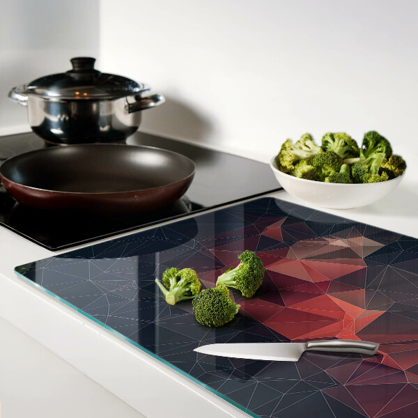 Tagliere in vetro temperato con motivo a geometria astratta nei toni del rosso