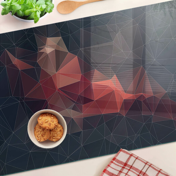 Tagliere in vetro temperato con motivo a geometria astratta nei toni del rosso