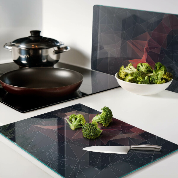 Tagliere in vetro temperato con motivo a geometria astratta nei toni del rosso