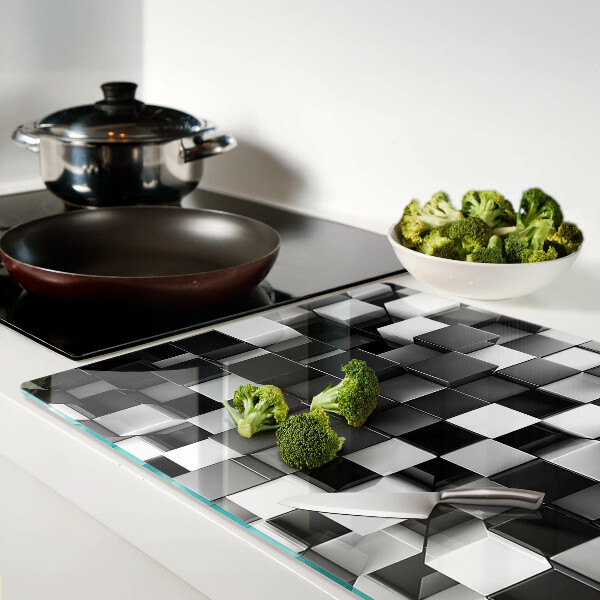 Tagliere in vetro temperato con motivo a scacchiera nei toni del bianco e nero