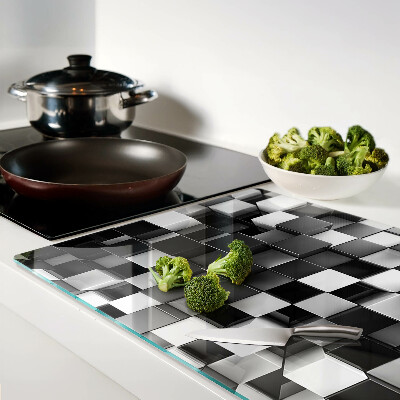 Tagliere in vetro temperato con motivo a scacchiera nei toni del bianco e nero