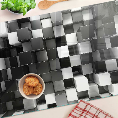 Tagliere in vetro temperato con motivo a scacchiera nei toni del bianco e nero