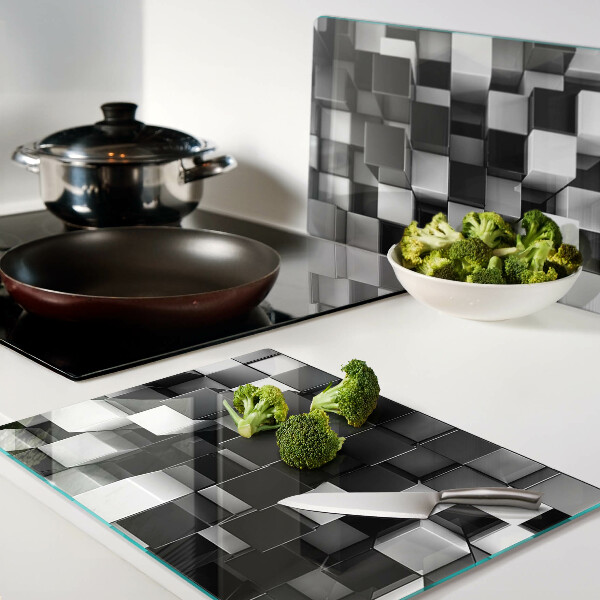 Tagliere in vetro temperato con motivo a scacchiera nei toni del bianco e nero
