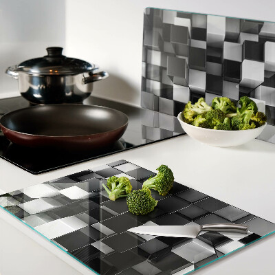 Tagliere in vetro temperato con motivo a scacchiera nei toni del bianco e nero