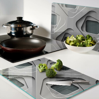 Tagliere in vetro temperato con motivi geometrici nei toni del grigio