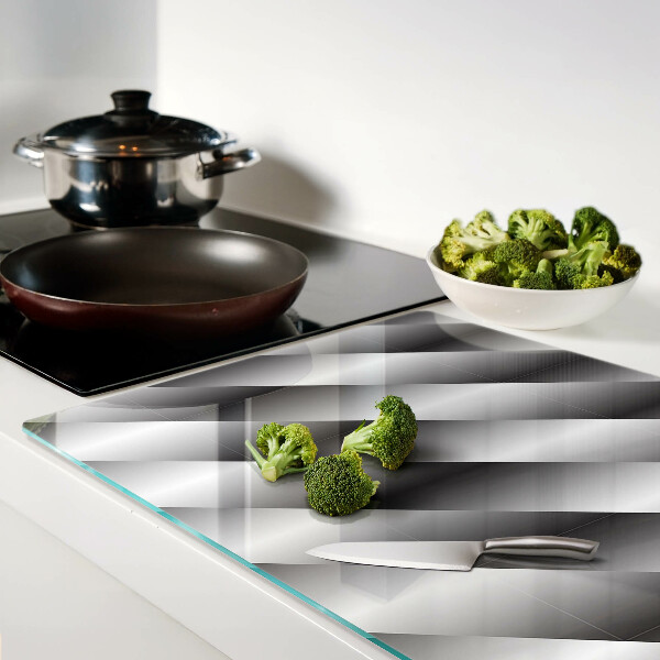 Tagliere in vetro temperato con motivi geometrici nei toni del grigio