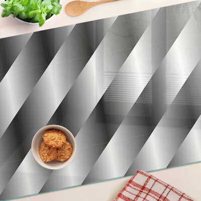 Tagliere in vetro temperato con motivi geometrici nei toni del grigio