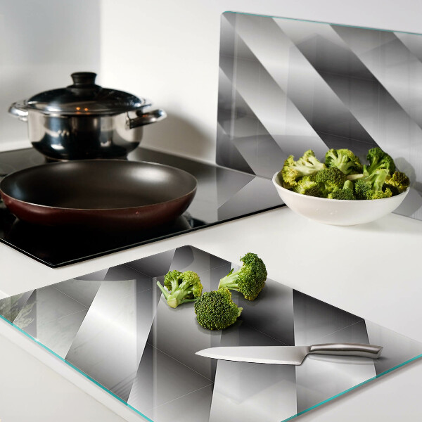 Tagliere in vetro temperato con motivi geometrici nei toni del grigio