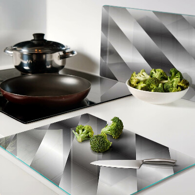 Tagliere in vetro temperato con motivi geometrici nei toni del grigio