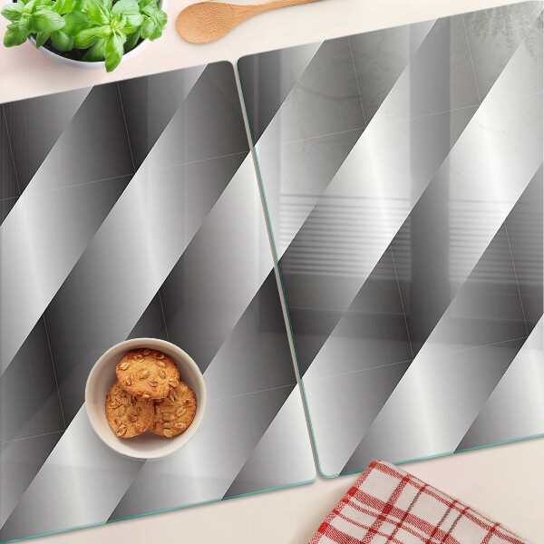 Tagliere in vetro temperato con motivi geometrici nei toni del grigio