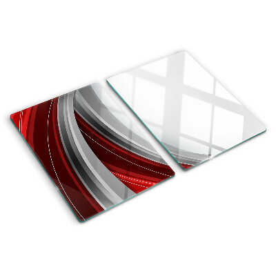 Tagliere in vetro con motivo a onde astratte nei toni del rosso e del grigio