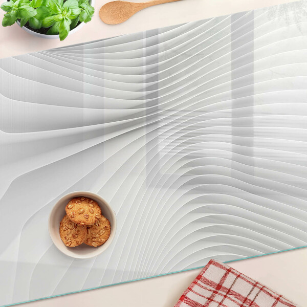 Tagliere in vetro temperato con motivo a onde e linee nei toni del grigio