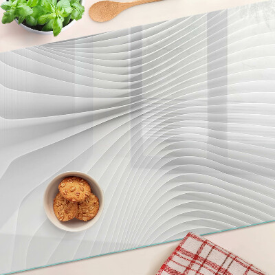 Tagliere in vetro temperato con motivo a onde e linee nei toni del grigio